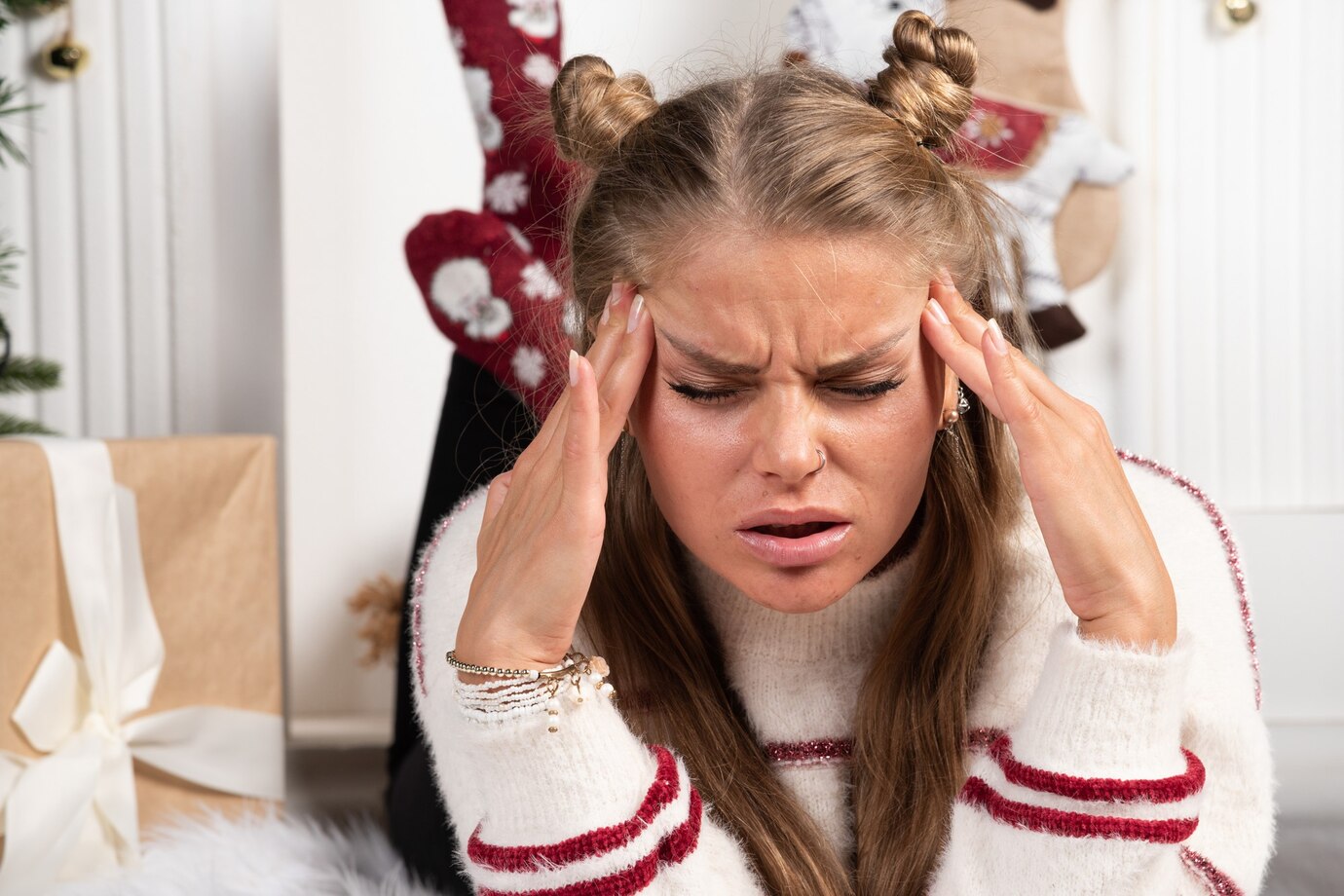 young-woman-posing-lying-down-carpet-christmas-interior_114579-80740